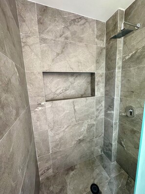 Shower, hair dryer, towels, toilet paper
