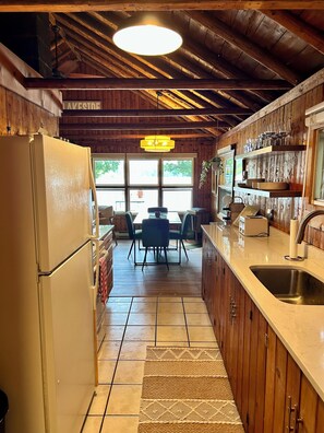 Toaster, cookware/dishes/utensils, dining tables
