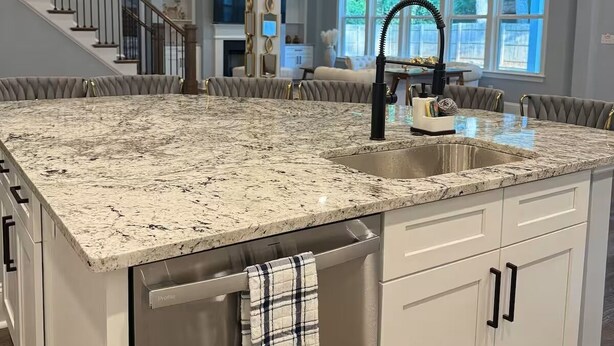 A spacious kitchen with a large granite island, stainless steel appliances, and pendant lighting. - Beautiful Escape, Mins from Carowinds & Lake Wylie (Charlotte)