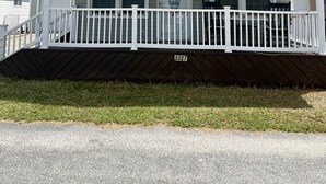 A single-story house with a front porch, a garage, and a number '5327' on the front. - 5327 Ocean Lakes Pet Friendly Golf Cart⛱️🏝️🩱🌊👙☀️🐚 (Myrtle Beach)