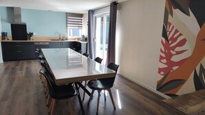 A modern kitchen with a dining area. - Vacation home - 9 people - "Relax à Sion" between sea and forest (Saint-Hilaire-de-Riez)