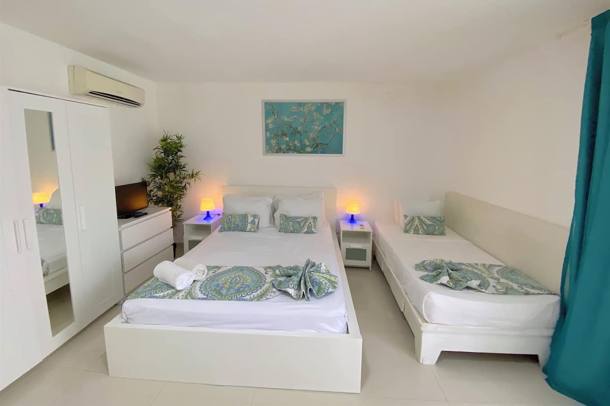 Basic Studio, Balcony, Pool View | In-room safe, iron/ironing board, free WiFi, bed sheets