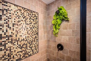Shower, hair dryer, soap, toilet paper