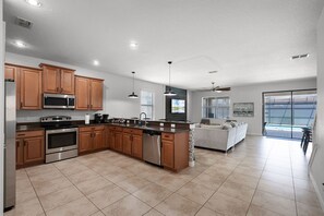 Fridge, microwave, oven, stovetop - Luxury 9BR w/ Arcade, Pool & Resort Waterpark – Near Disney (Four Corners)