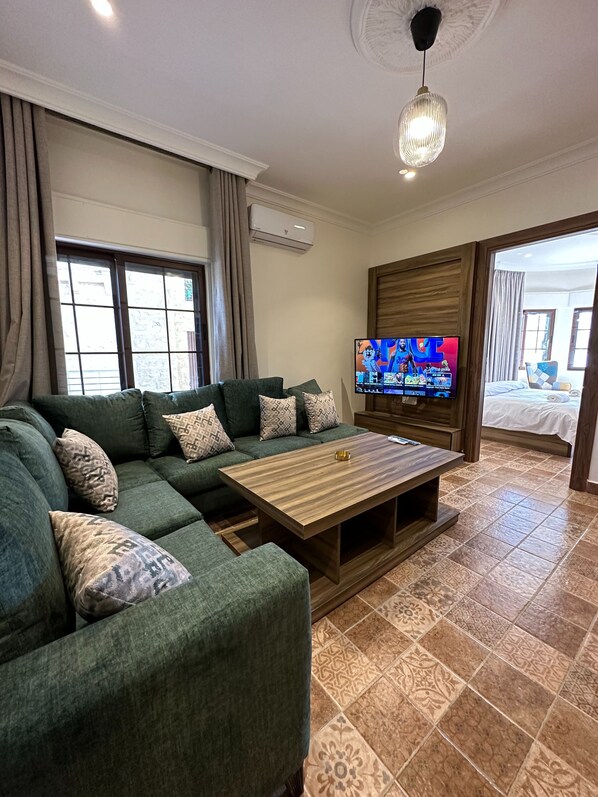 Apartment, 1 Bedroom, Accessible, Smoking | Living room | Flat-screen TV - 10 Antica Jabal Al Lweibdeh (Amman)