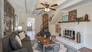 Smart TV, fireplace, books, offices