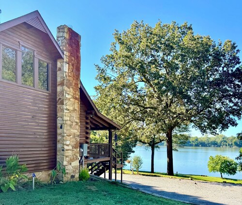 Log cabin with walkout basement and loft located on Ohio River’s edge.