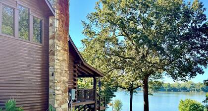 Log cabin with walkout basement and loft located on Ohio River’s edge.
