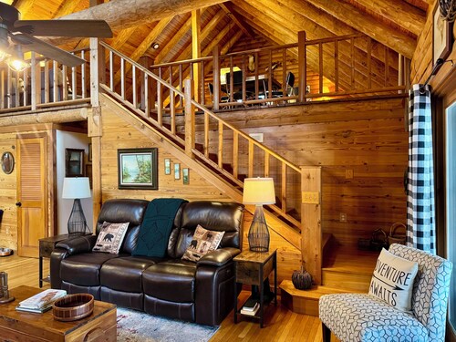 Log cabin with walkout basement and loft located on Ohio River’s edge.