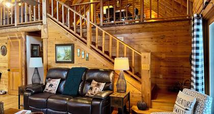 Log cabin with walkout basement and loft located on Ohio River’s edge.