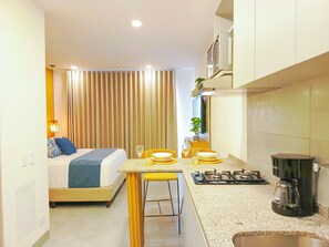 Fridge, microwave, stovetop, coffee/tea maker