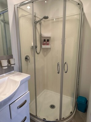 Hair dryer, towels, soap, shampoo