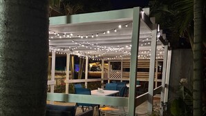 Outdoor dining - Penguins on the Beach | 2BR Steps to Beach & Downtown w/pool | Unit 4 (Cocoa Beach)