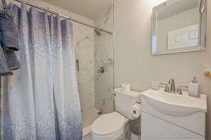 Shower, towels, soap, toilet paper