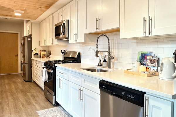 Bright and clean kitchen, fully equipped for effortless home cooking.