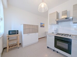 Fridge, microwave, cookware/dishes/utensils