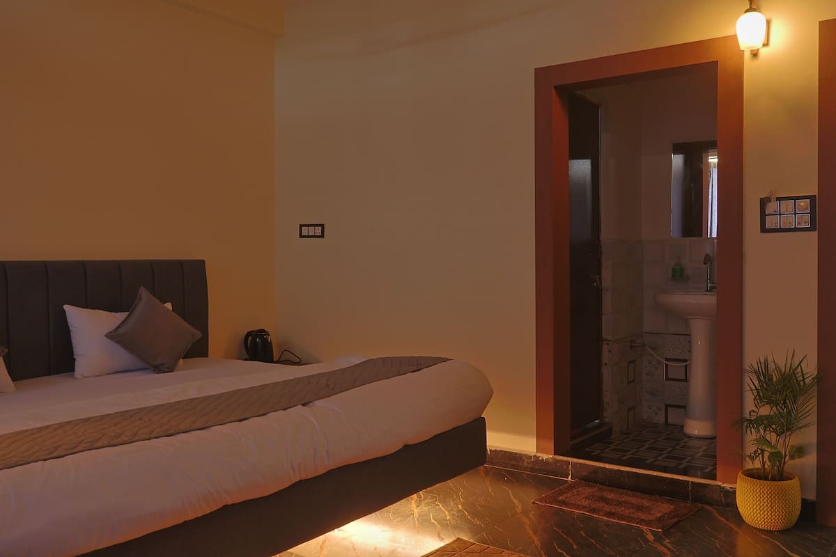 Chambre Deluxe | Draps en coton égyptien, literie de qualité, bureau