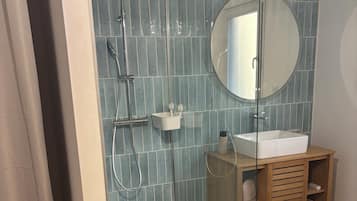 Shower, hair dryer, towels, toilet paper