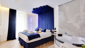 A modern bedroom with a bed, a vanity with a bathtub, and a large window with curtains. - Suberb Suite With Jacuzzi Le Marais Beaubourg (Paris)