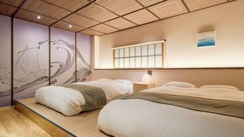 A traditional Japanese-style bedroom with tatami flooring, a shoji screen, and a futon bed.