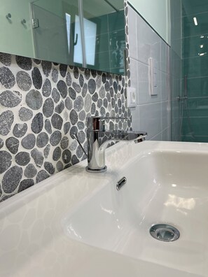 Shower, hair dryer, towels, toilet paper