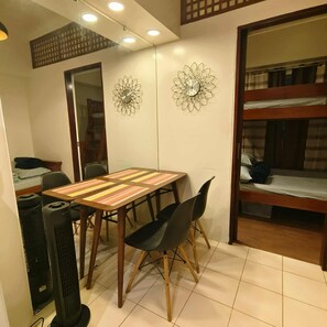 Family Condo, 1 Bedroom, Non Smoking, Pets allowed | Living room | 32-inch Smart TV with digital channels, ping pong - Cozy City Stay in Baguio (Baguio)
