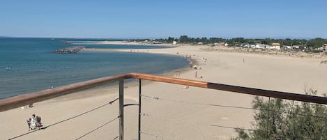 On the beach, sun-loungers