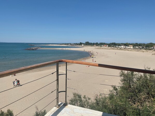 On the beach, sun-loungers
