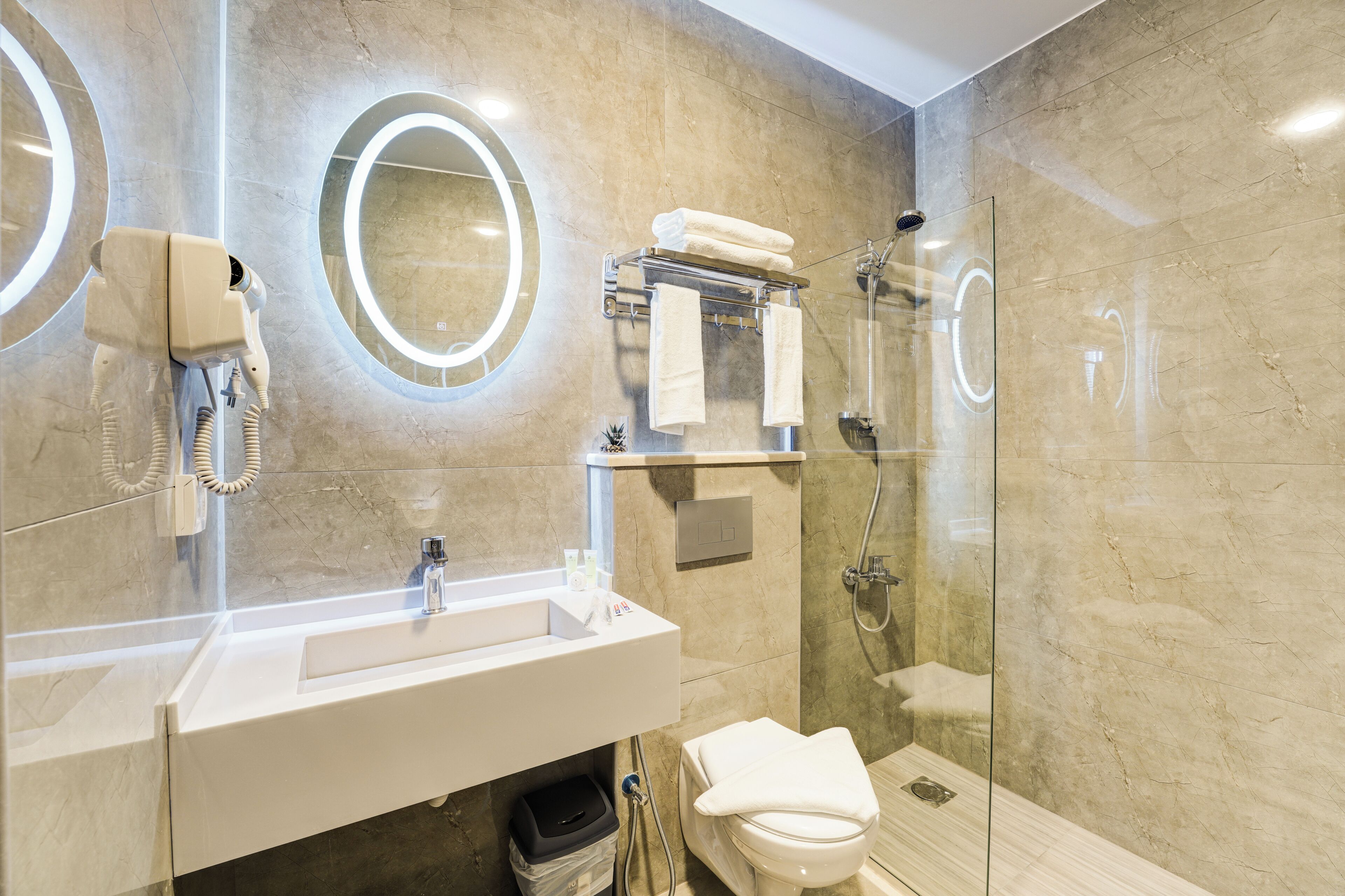 Shower, hair dryer, slippers, towels