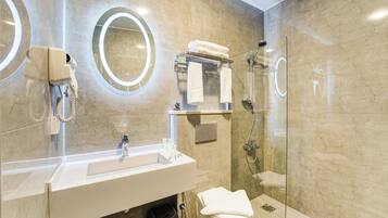 Shower, hair dryer, slippers, towels