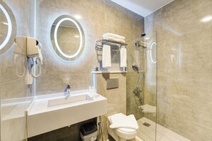 Shower, hair dryer, slippers, towels