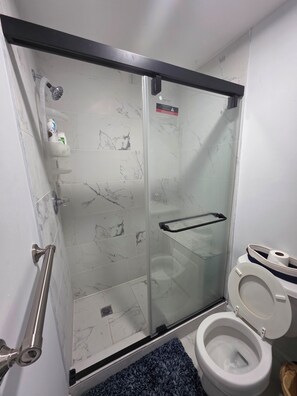 Shower, towels, soap, toilet paper