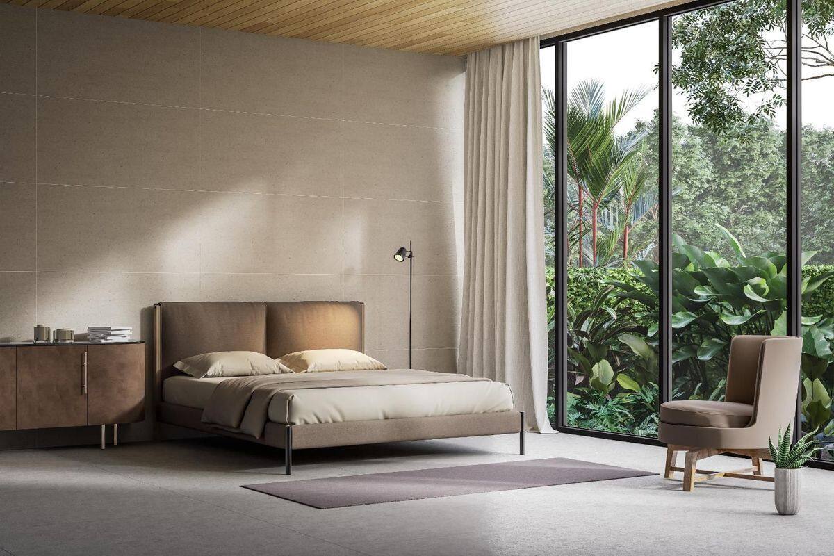 A modern bedroom with a large window, a bed, a chair, and a nightstand.