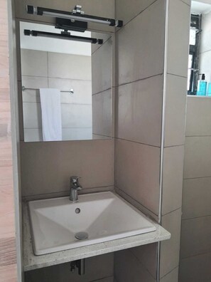 Shower, towels, soap, toilet paper