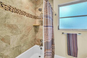 Shower, hair dryer, towels, shampoo
