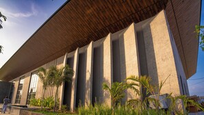 A modern building with a flat roof, large windows, and a concrete facade. - AMARTARA THE RESORT (Abu Road)