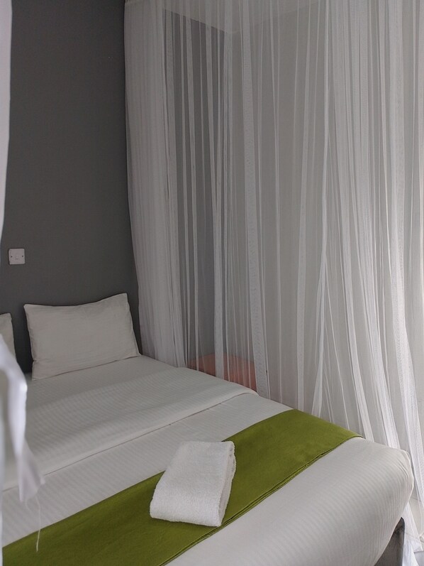 1 غرفة نوم ومكواة/لوح كي وخدمة الإنترنت وملاءات أسرّة