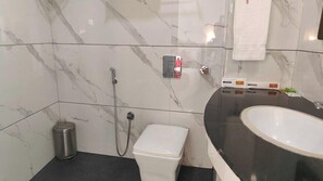 Premium Room, Mountain View | Bathroom | Slippers - Hotel Guru Surbhi (Paonta Sahib)