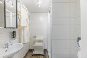 Shower, hair dryer, towels, soap