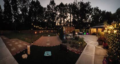 Private Urban Oasis with heated pool spa, outdoor bar and TV, firepit, corn hole