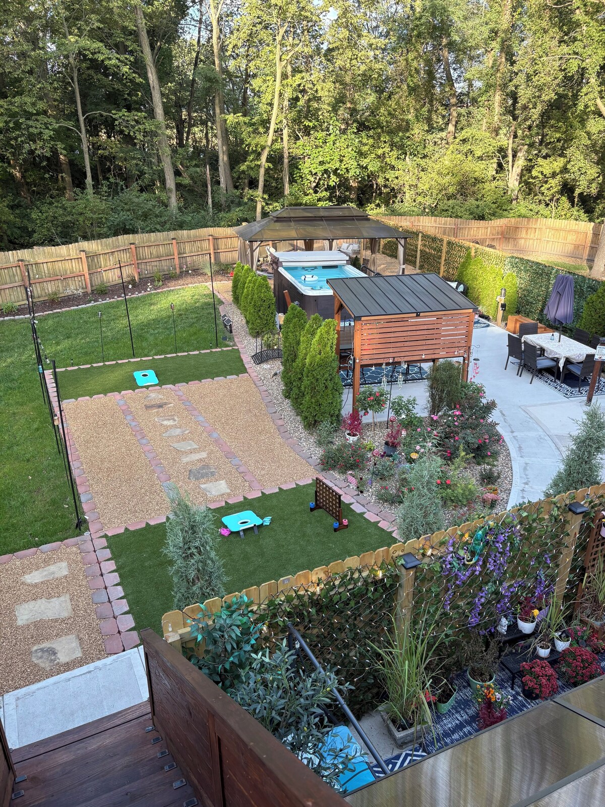 Private Urban Oasis with heated pool spa, outdoor bar and TV, firepit, corn hole