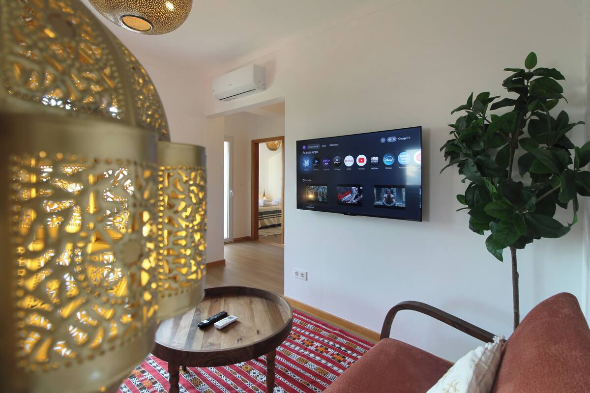 Apartment, Garden View | Living area | 50-inch Smart TV with digital channels