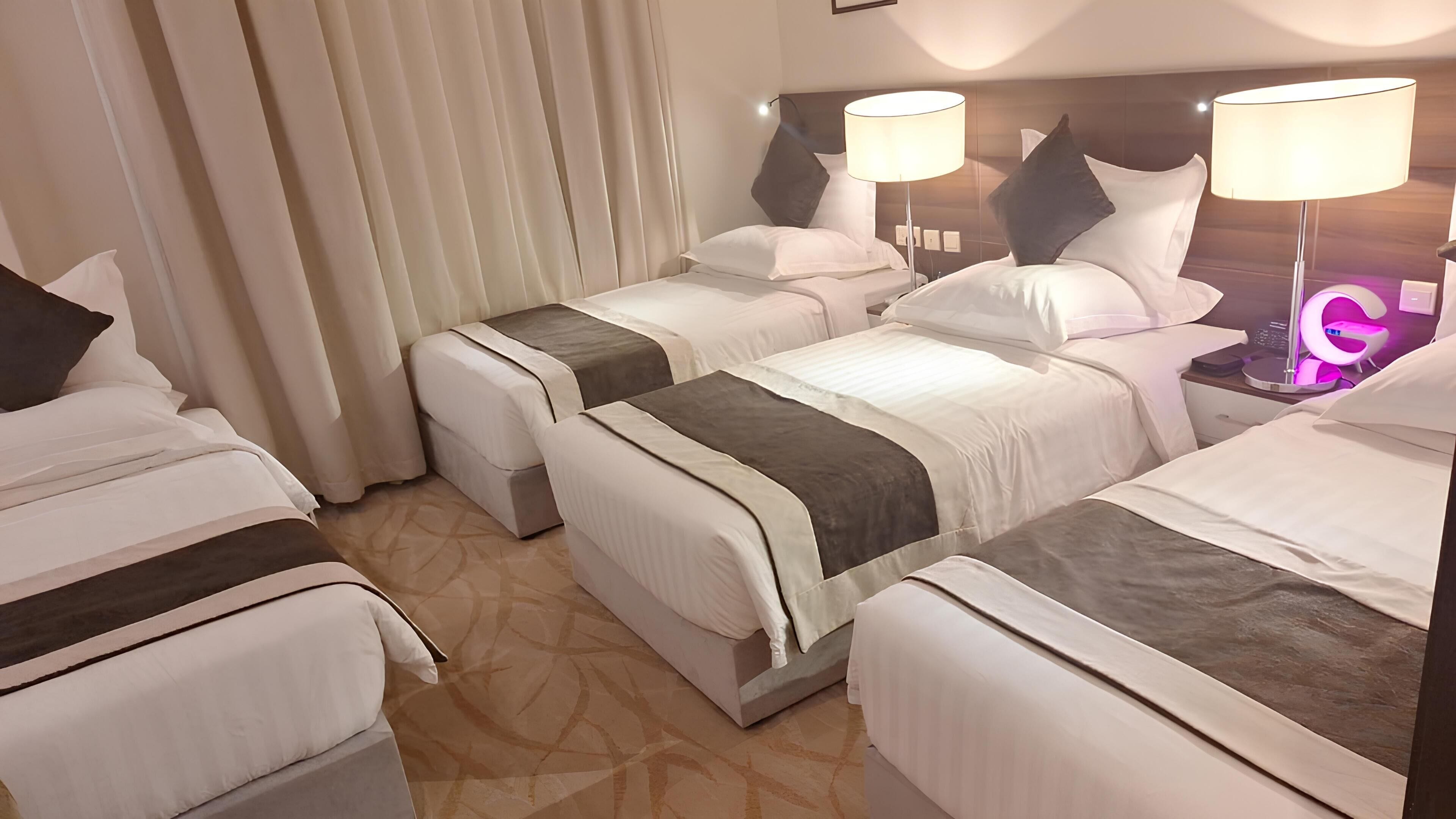 Deluxe Quadruple Room | In-room safe, blackout drapes, soundproofing, iron/ironing board