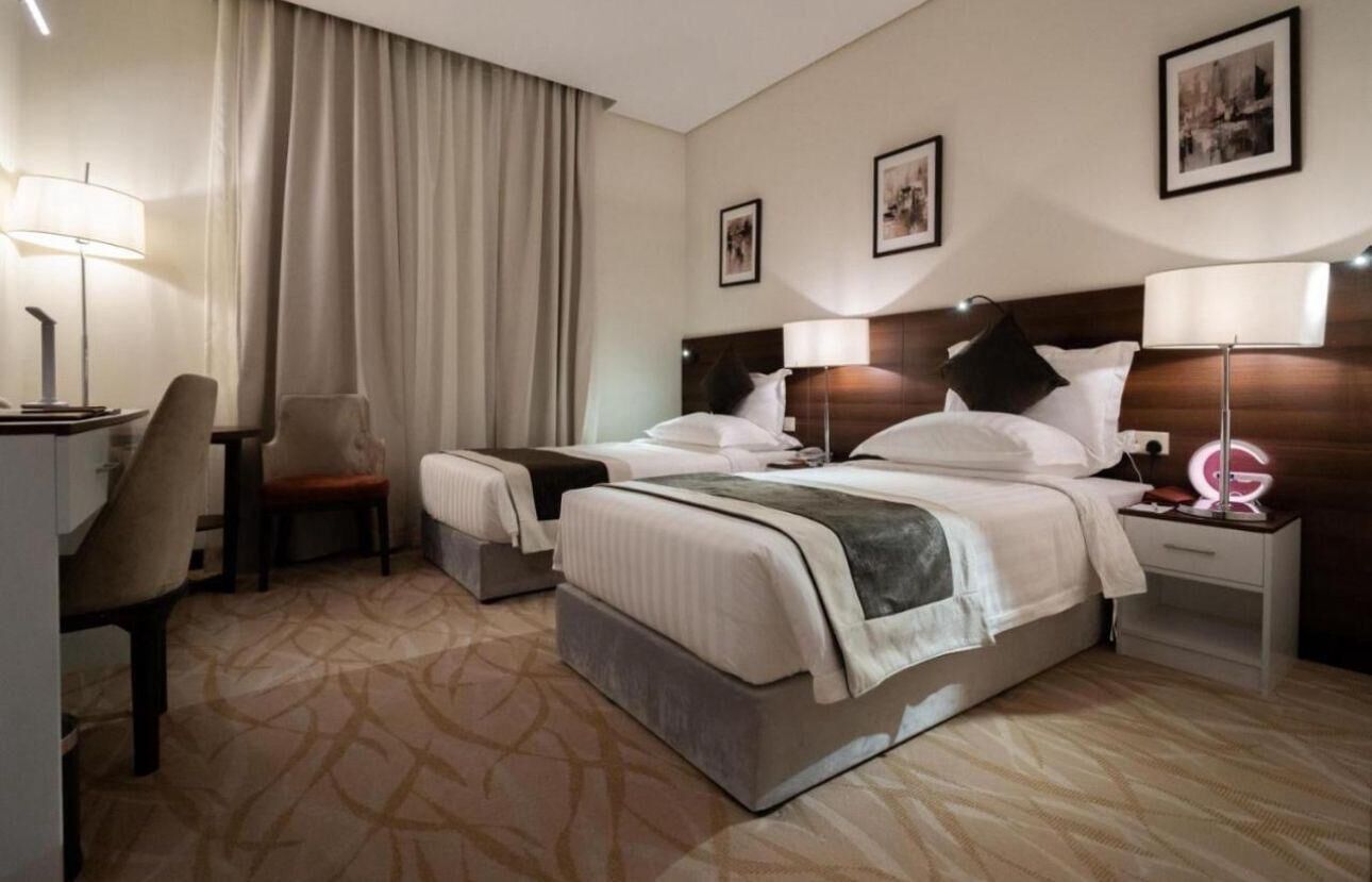 Deluxe Twin Room | Minibar, in-room safe, blackout curtains, soundproofing