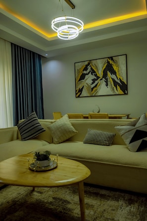 Deluxe Apartment, Balcony | Living area