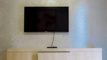 Deluxe Apartment, Balcony | Living area | TV