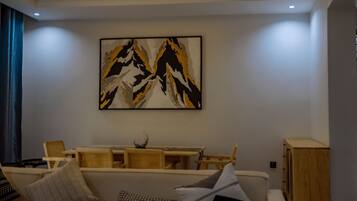 Deluxe Apartment, Balcony | Living area