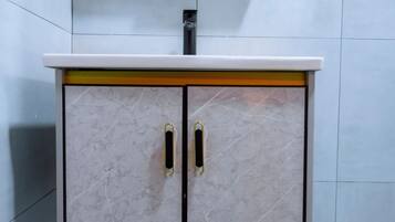 Deluxe Apartment, Balcony | Bathroom | Slippers, towels, soap, shampoo