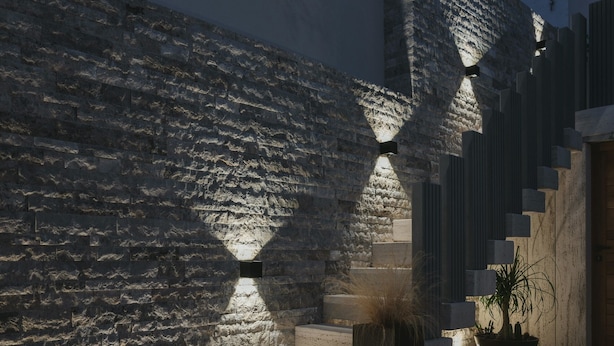 A modern outdoor staircase with stone steps and walls, leading to a higher level. - Al Borgo Luxury suite 01 (Abbasanta)