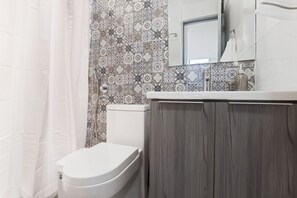 Shower, towels, soap, toilet paper